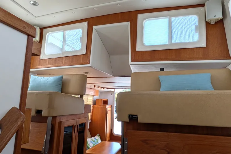 Slide: The Image of Interior of 2010 Nordic Tug 32 with wooden finishes and cozy seating. - 46
