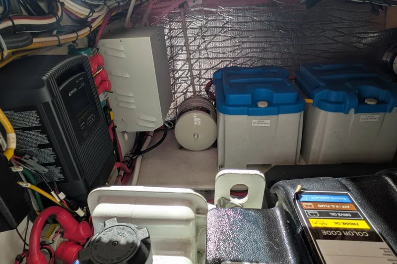 Slide: The Image of Engine room of a 2010 Nordic Tug 32 with batteries and electrical components. - 50