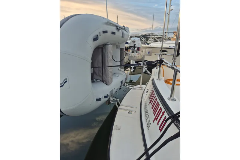 Slide: The Image of Nordic Tug 32 (2010) with inflatable dinghy attached at marina. - 5