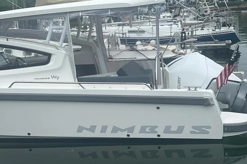 Slide: The Image of 2024 Nimbus Weekender 9 boat docked, featuring sleek design and modern amenities. - 11