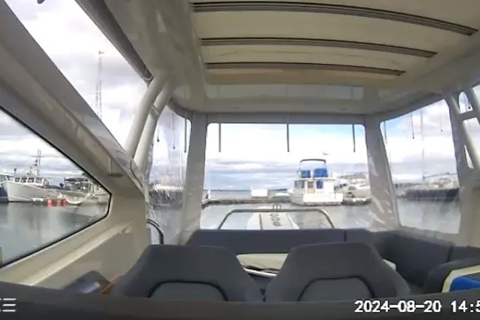 Slide: The Image of Interior view of 2024 Nimbus Weekender 9 boat docked at marina. - 15