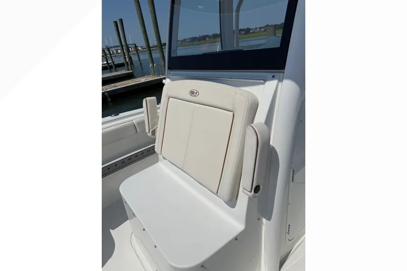 Slide: The Image of 2021 Sea Hunt Gamefish 30FS boat seat, docked at marina. - 20