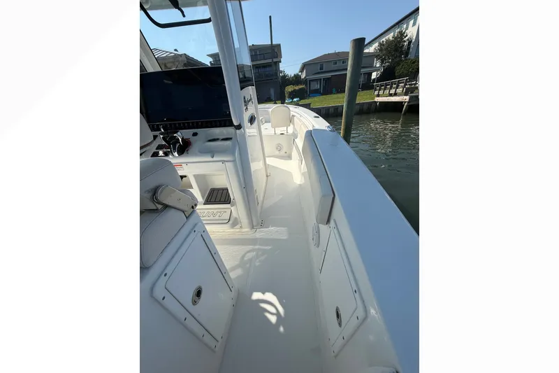 Slide: The Image of 2021 Sea Hunt Gamefish 30FS boat interior, featuring sleek design and modern controls. - 16