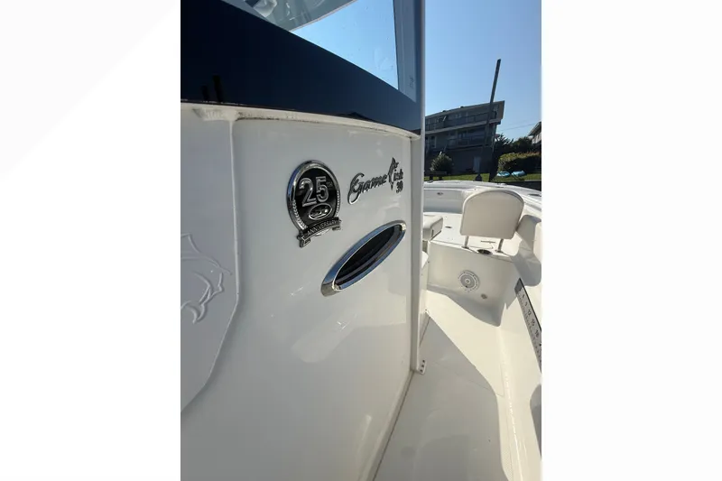 Slide: The Image of 2021 Sea Hunt Gamefish 30FS boat, 25th anniversary emblem, sleek white design. - 17