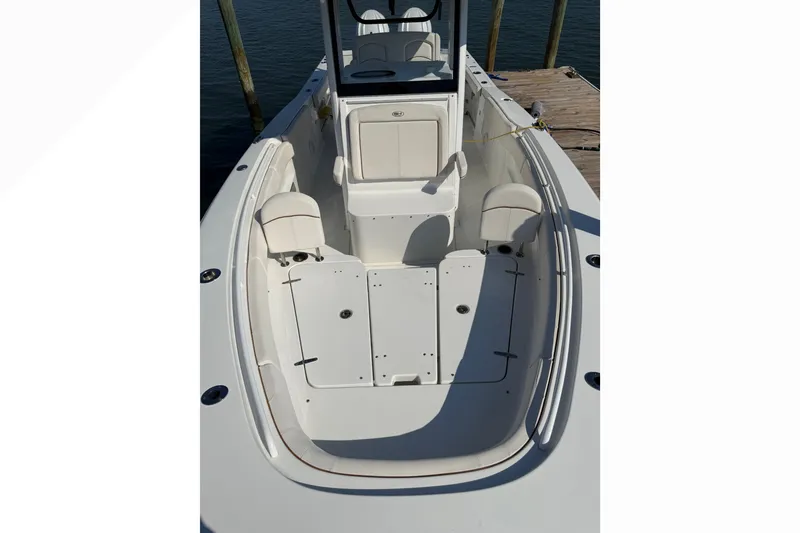Slide: The Image of 2021 Sea Hunt Gamefish 30FS boat interior with seating and storage compartments. - 11