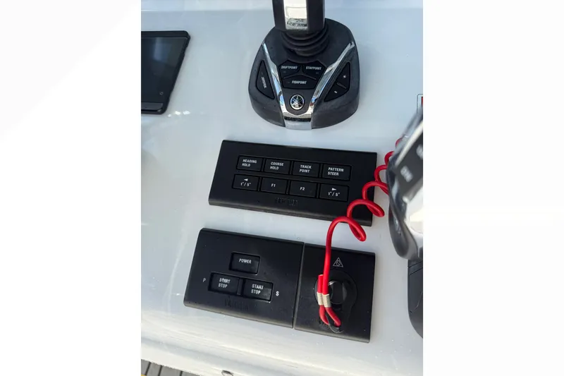 Slide: The Image of Control panel of a 2021 Sea Hunt Gamefish 30FS boat with navigation buttons. - 8