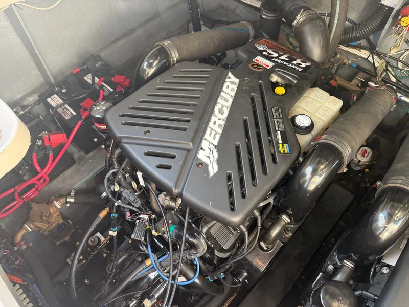 Slide: The Image of Engine compartment of a 2003 Sea Ray 340 Sundancer with a Mercury engine. - 28