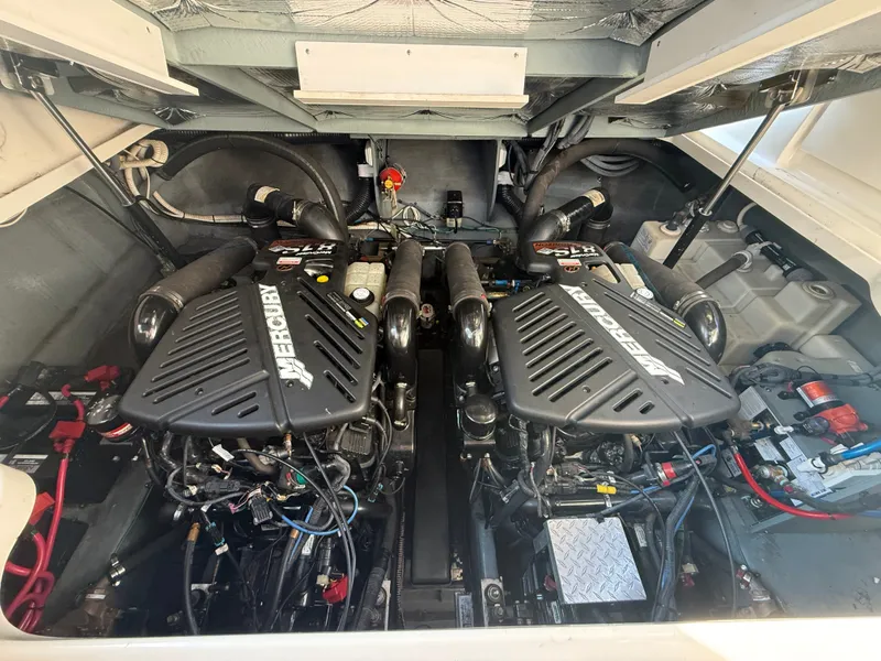 Slide: The Image of The engine room of a 2003 Sea Ray 340 Sundancer features two powerful engines. - 26