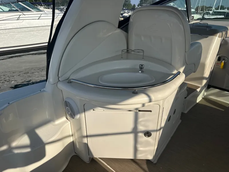Slide: The Image of The interior of a 2003 Sea Ray 340 Sundancer features a compact sink with fixtures. - 8
