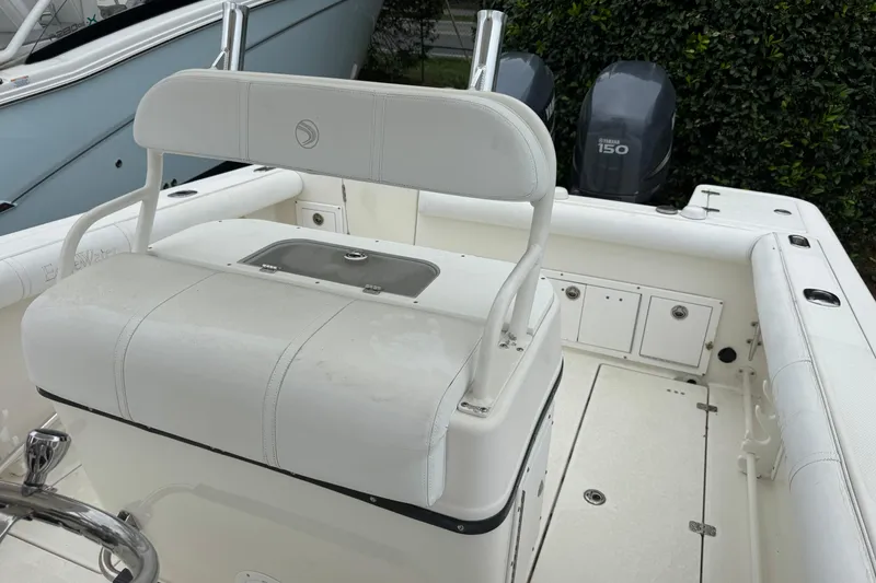 Slide: The Image of 2007 Edgewater 245CC boat interior with seating and dual Yamaha 150 engines. - 7