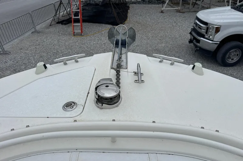 Slide: The Image of Bow of 2007 Edgewater 245CC boat with anchor and cleats visible. - 2