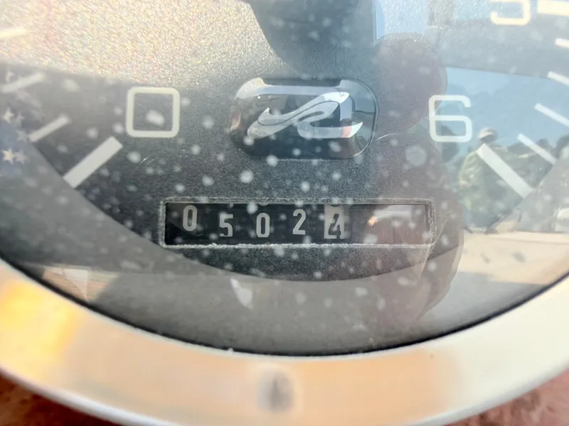 Slide: The Image of Close-up of a boat tachometer showing 502.4 hours on the meter. - 13