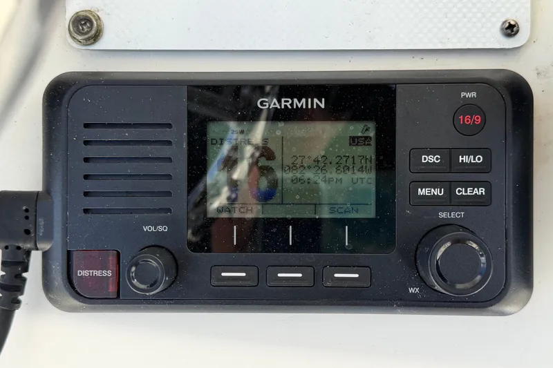 Slide: The Image of Garmin marine radio on 2015 NauticStar 231 Coastal boat dashboard. - 28