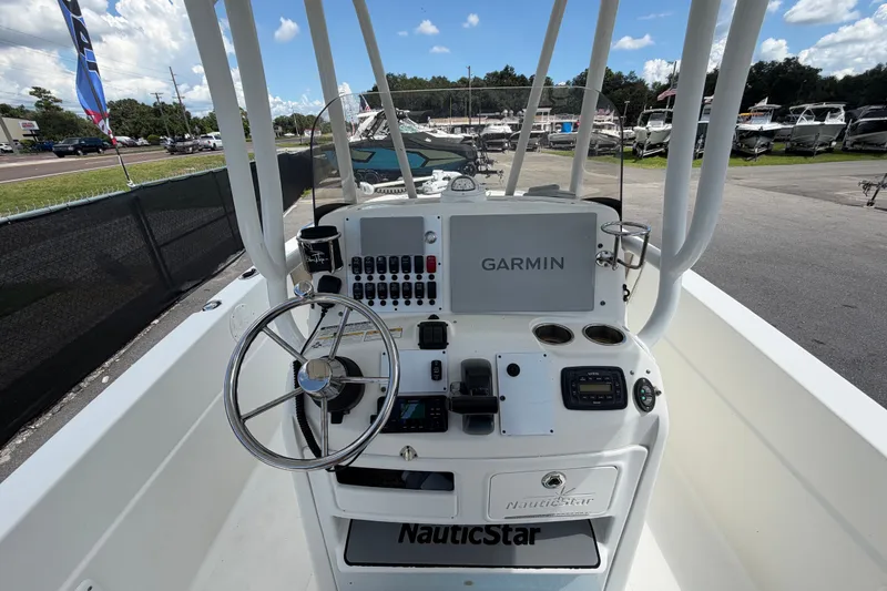 Slide: The Image of 2015 NauticStar 231 Coastal boat dashboard with Garmin navigation system. - 18