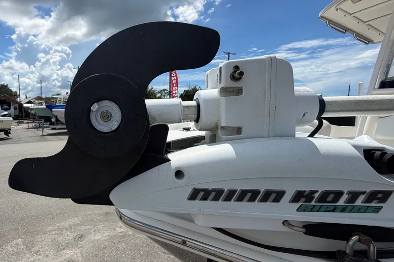 Slide: The Image of Minn Kota Riptide motor on 2015 NauticStar 231 Coastal boat under cloudy sky. - 48