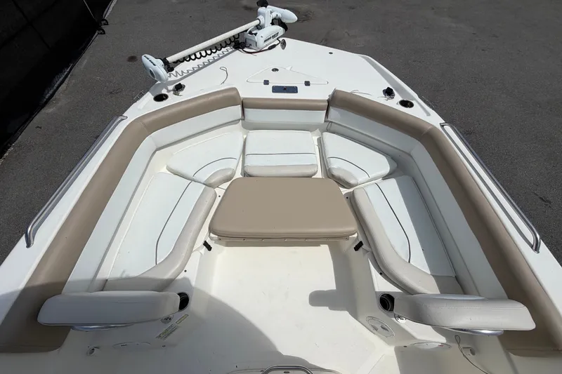 Slide: The Image of 2015 NauticStar 231 Coastal boat interior with seating and storage compartments. - 40