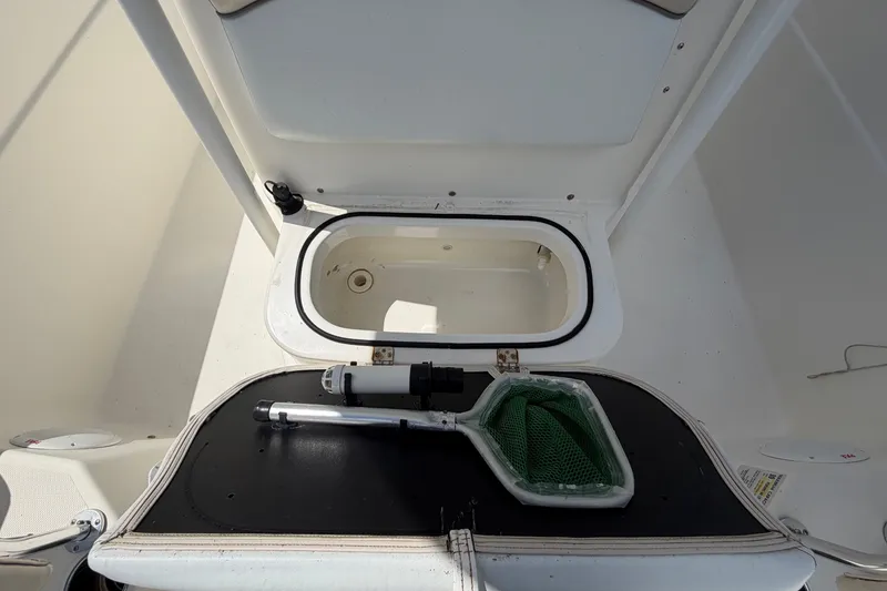 Slide: The Image of Interior view of 2015 NauticStar 231 Coastal boat storage compartment. - 55