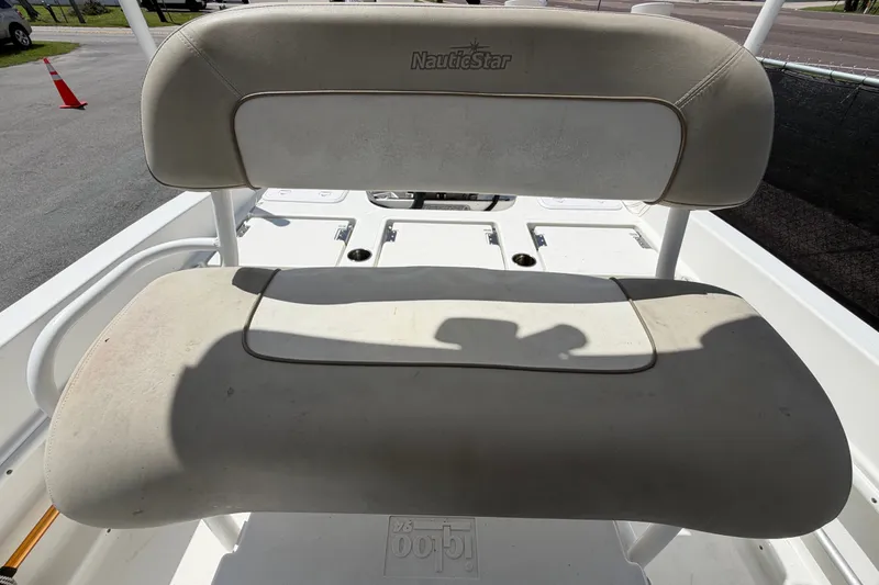 Slide: The Image of 2015 NauticStar 231 Coastal boat seat with beige upholstery. - 57