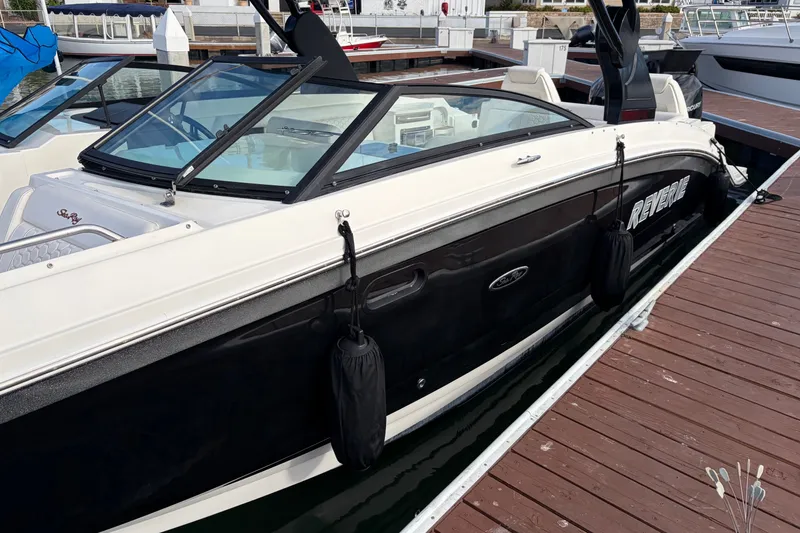 Slide: The Image of 2019 Sea Ray SDX 290 Outboard boat docked at marina. - 6