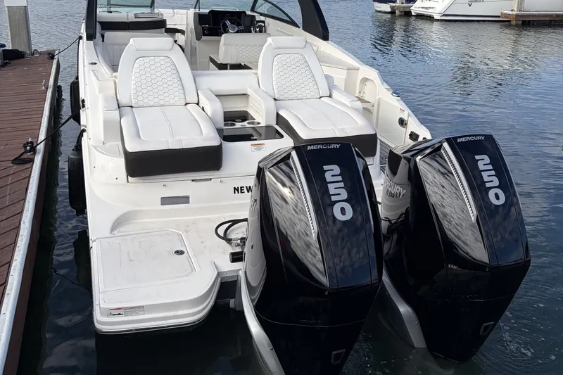 Slide: The Image of 2019 Sea Ray SDX 290 Outboard with twin Mercury engines docked at marina. - 9