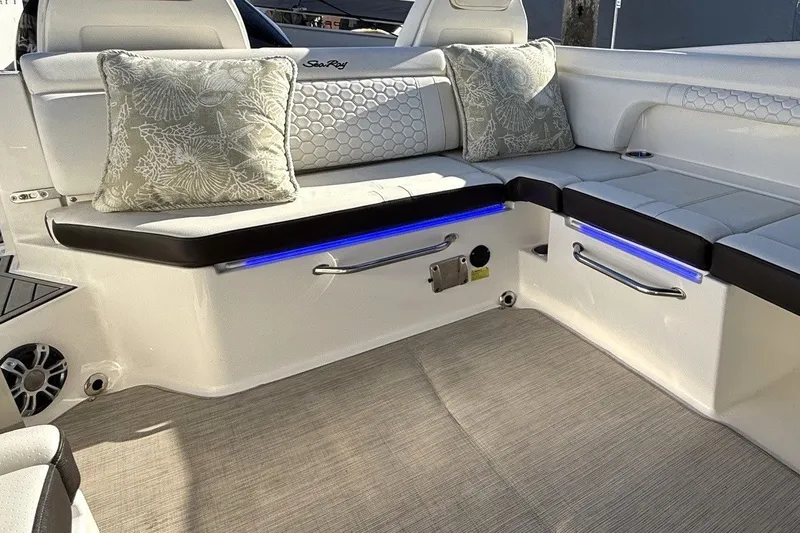 Slide: The Image of Luxurious seating area on a 2019 Sea Ray SDX 290 Outboard boat with decorative cushions. - 13