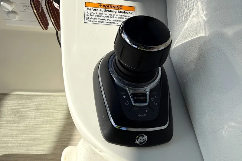 Slide: The Image of Joystick control on 2019 Sea Ray SDX 290 Outboard boat with Skyhook feature. - 28