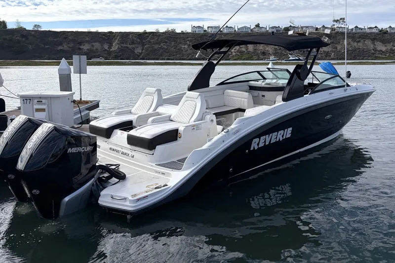 Slide: The Image of 2019 Sea Ray SDX 290 Outboard boat docked in Newport Beach marina. - 2