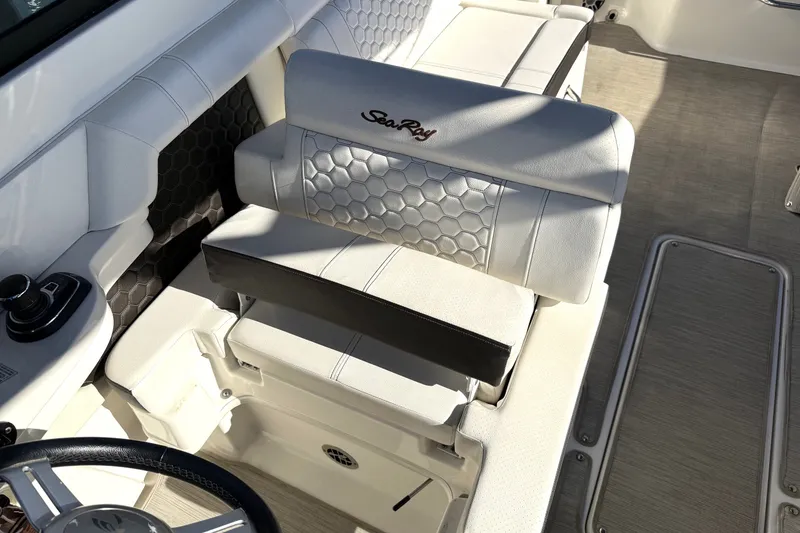 Slide: The Image of 2019 Sea Ray SDX 290 Outboard boat interior with white leather seating. - 24