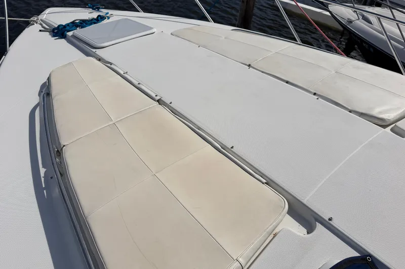 Slide: The Image of 2003 Formula 37 Performance Cruiser deck with cushioned seating and hatch. - 9