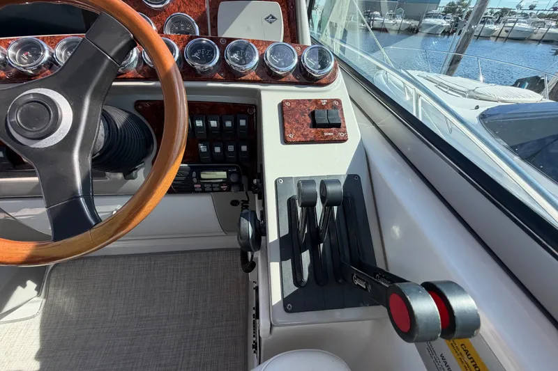 Slide: The Image of Cockpit of 2003 Formula 37 Performance Cruiser with steering wheel and control panel. - 25