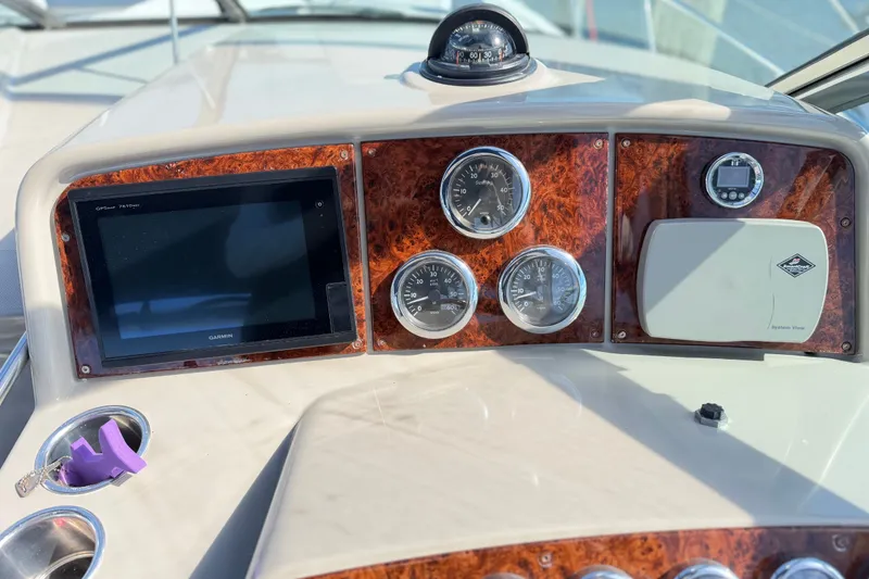 Slide: The Image of Dashboard of a 2003 Formula 37 Performance Cruiser with gauges and Garmin GPS. - 24