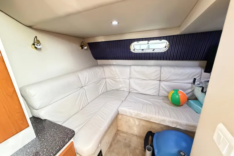 Slide: The Image of Interior of 2003 Formula 37 Performance Cruiser with white leather seating and nautical decor. - 45
