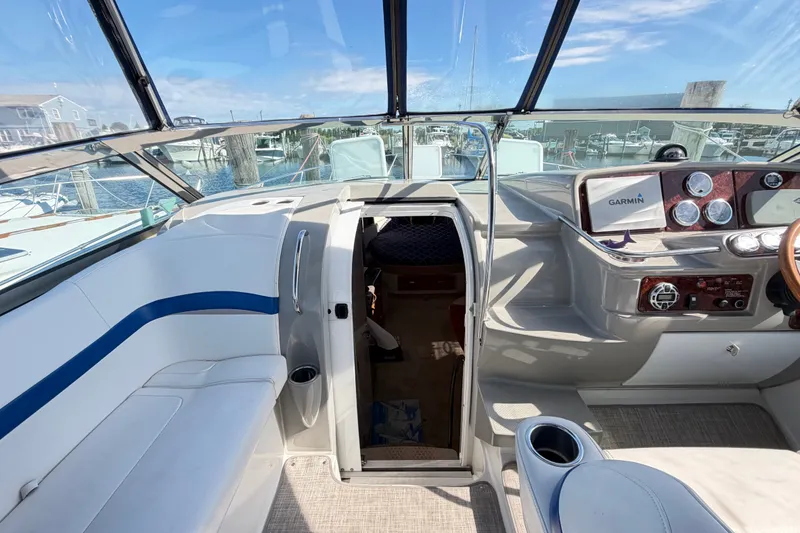 Slide: The Image of 2003 Formula 37 Performance Cruiser cockpit with Garmin navigation, marina view. - 18