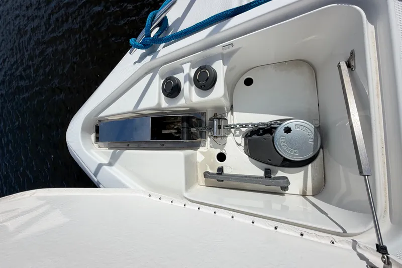 Slide: The Image of Anchor compartment of a 2003 Formula 37 Performance Cruiser with chain and winch. - 12