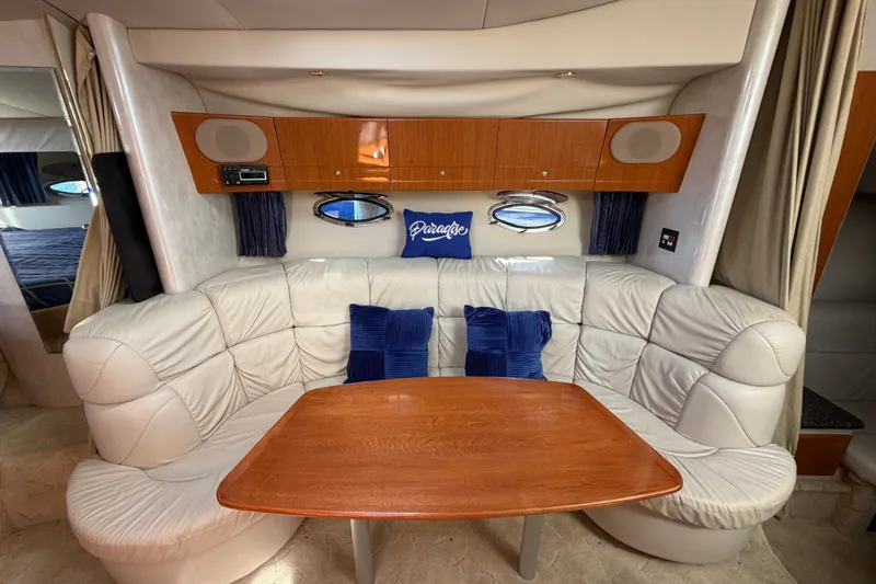 Slide: The Image of Luxurious interior of 2003 Formula 37 Performance Cruiser with plush seating and wooden table. - 41