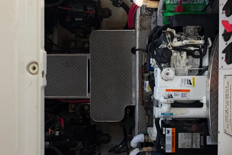 Slide: The Image of Engine compartment of a 2003 Formula 37 Performance Cruiser with visible machinery and components. - 57