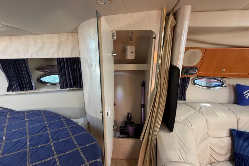 Slide: The Image of Interior of a 2003 Formula 37 Performance Cruiser with bed, storage, and seating area. - 40