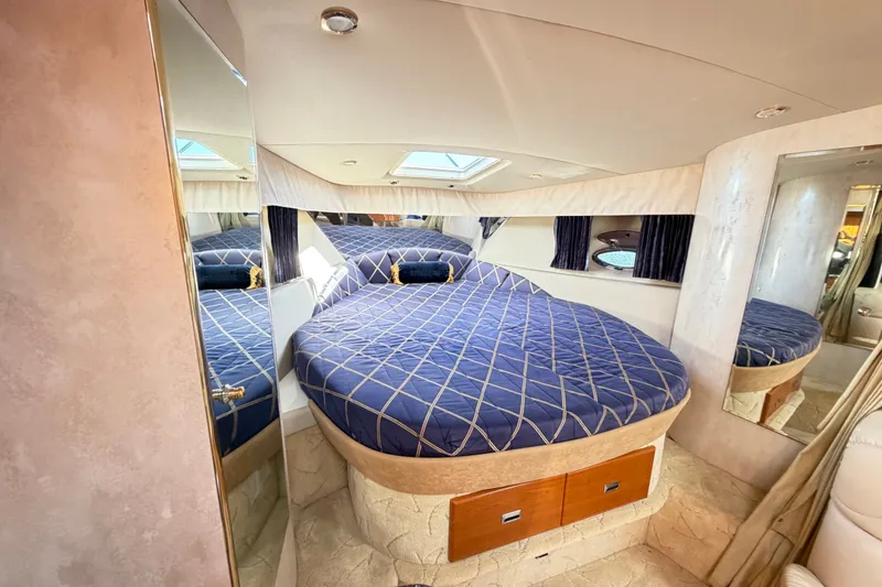 Slide: The Image of Luxurious cabin interior of a 2003 Formula 37 Performance Cruiser with a cozy bed. - 37