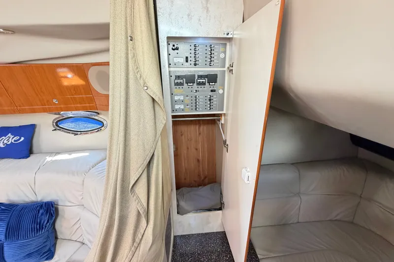 Slide: The Image of Interior of 2003 Formula 37 Performance Cruiser with electrical panel and cozy seating area. - 42