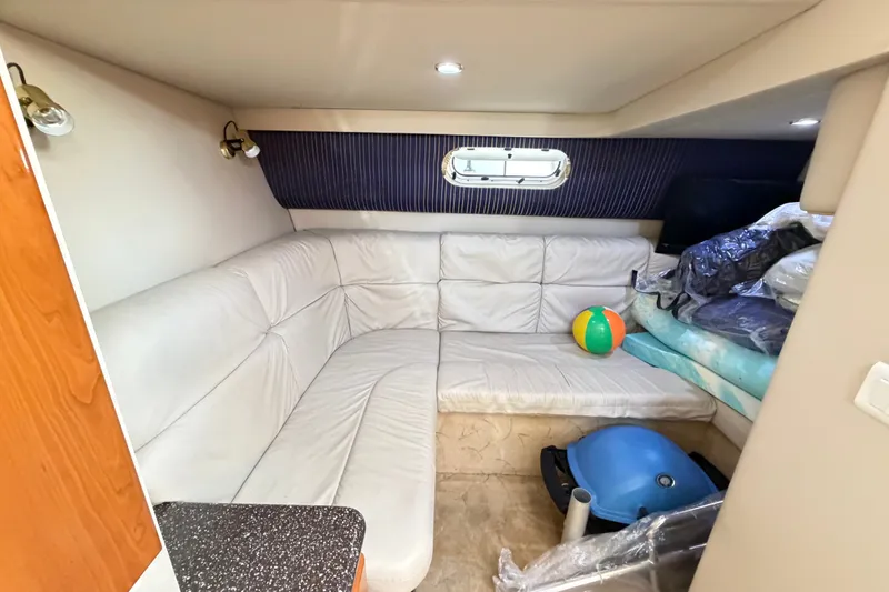 Slide: The Image of Interior of 2003 Formula 37 Performance Cruiser with white leather seating and a beach ball. - 47