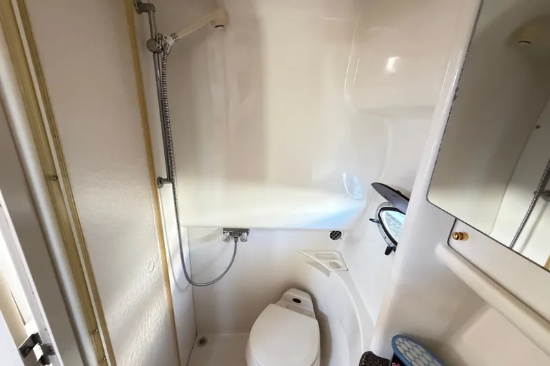 Slide: The Image of Compact bathroom in 2003 Formula 37 Performance Cruiser with shower and toilet. - 49