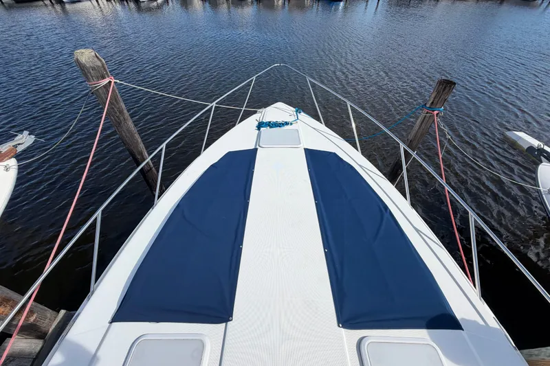 Slide: The Image of 2003 Formula 37 Performance Cruiser docked, featuring sleek deck design and blue covers. - 8