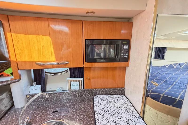 Slide: The Image of Interior of 2003 Formula 37 Performance Cruiser with kitchenette and cozy sleeping area. - 34