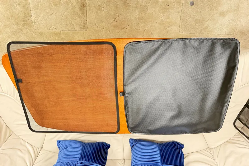Slide: The Image of Interior of 2003 Formula 37 Performance Cruiser with wooden table and blue cushions. - 50