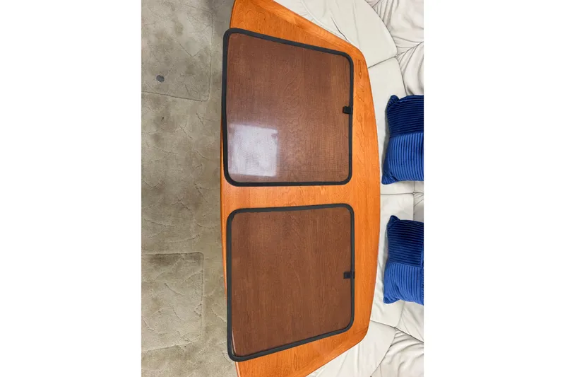 Slide: The Image of Wooden table with mesh covers on a Formula 37 Performance Cruiser, 2003 model. - 51