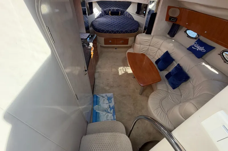 Slide: The Image of Interior of 2003 Formula 37 Performance Cruiser with seating, table, and bed. - 28