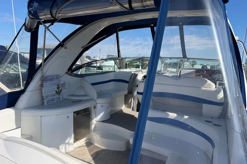 Slide: The Image of 2003 Formula 37 Performance Cruiser interior with blue and white seating, showcasing luxury design. - 13