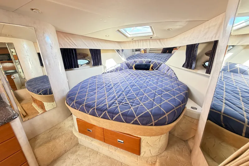 Slide: The Image of Luxurious cabin interior of a 2003 Formula 37 Performance Cruiser with plush bedding. - 38