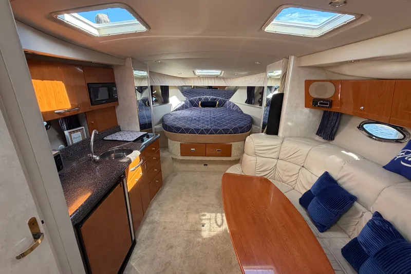 Slide: The Image of Luxurious interior of a 2003 Formula 37 Performance Cruiser with kitchen and seating area. - 29