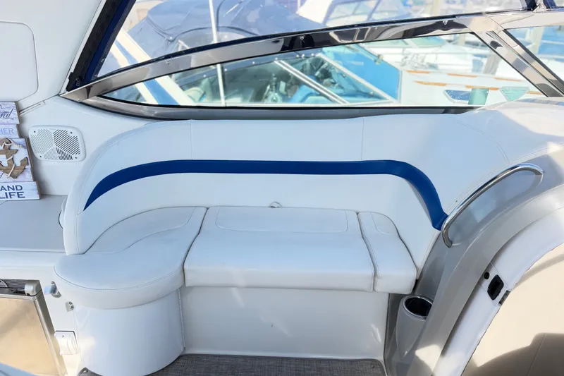 Slide: The Image of Interior seating of a 2003 Formula 37 Performance Cruiser, featuring white and blue upholstery. - 19